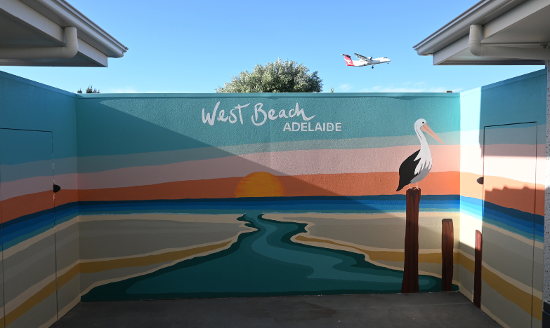 west beach painted mural Coastal beach mural with a pelican painted on an outdoor wall
