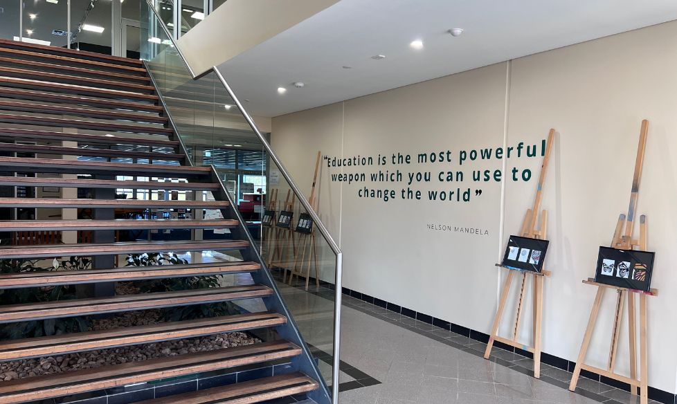 Nelson Mandela education quote hand-painted beside a stairwell at St Columba College