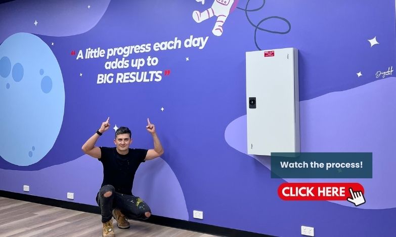 TUTORS SA Hand-painted motivational wall lettering on a blue office wall