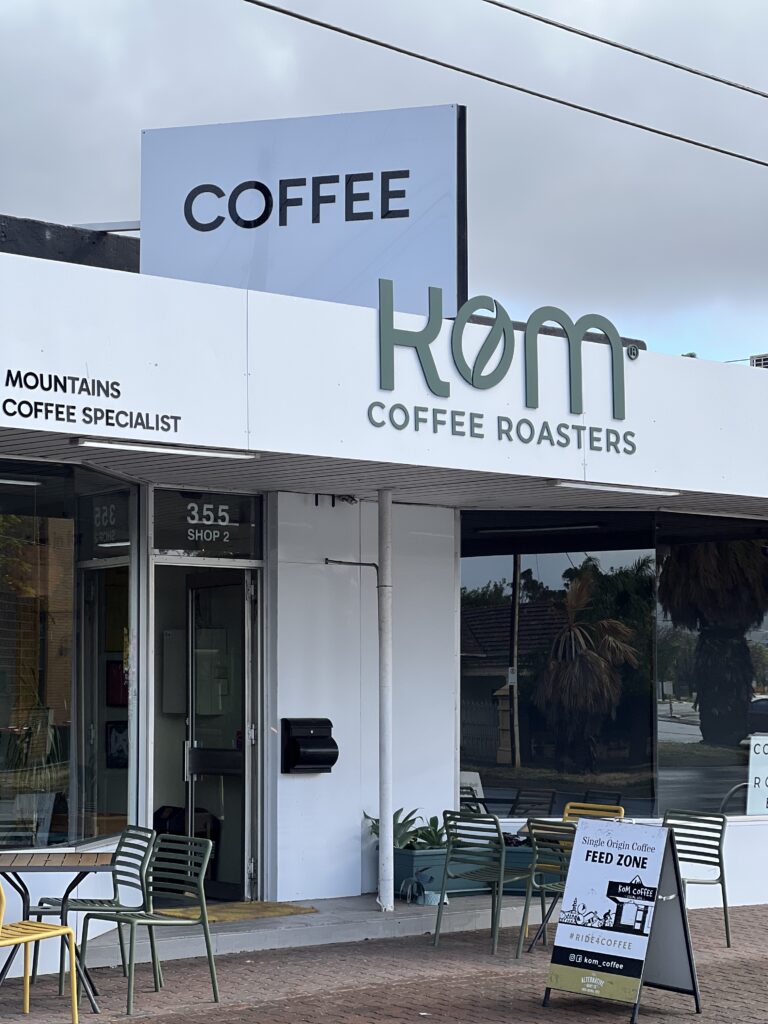 Finished KOM Coffee Roasters shopfront with the COFFEE sign and new facade