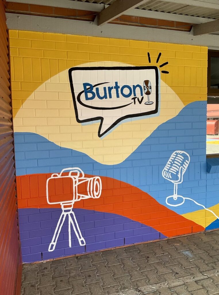 Hand-painted camera and microphone on the Burton TV school mural