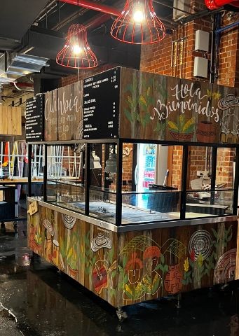 Cumbia Bar Kitchen market stall with the old folkloric artwork before the rebrand