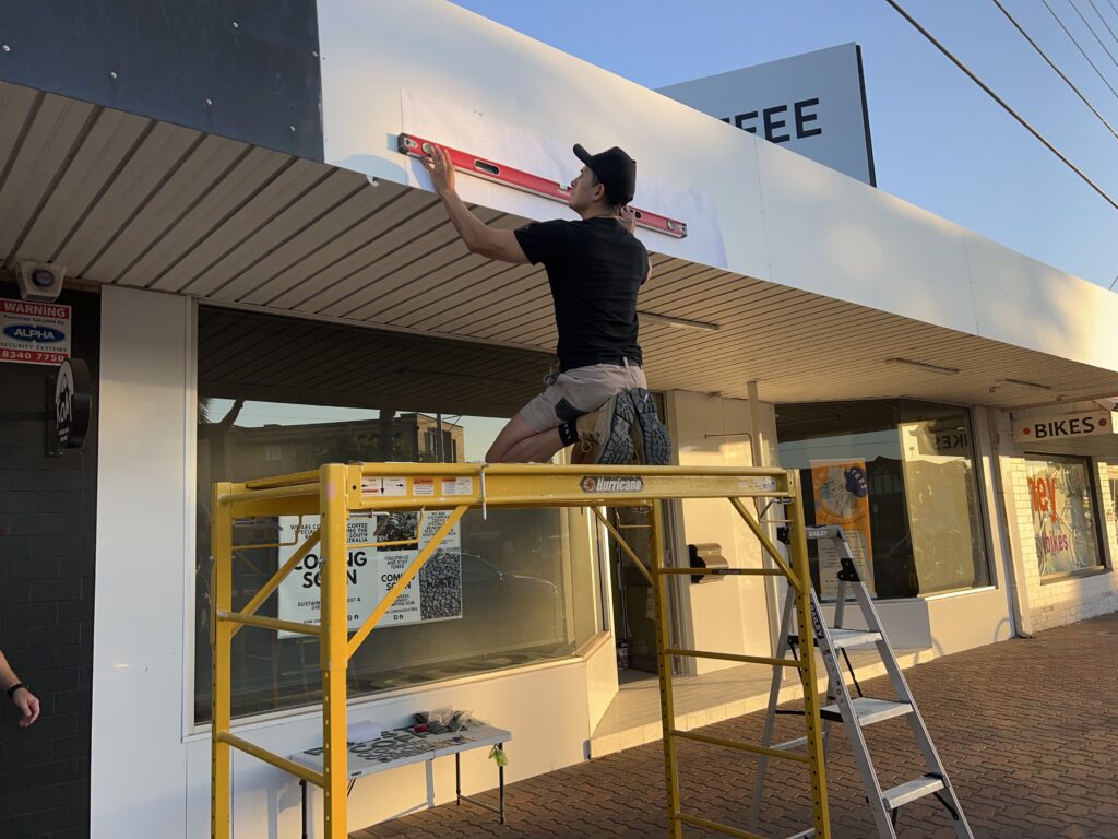 Diegodalo levelling the King of the Mountains lettering layout on the KOM facade