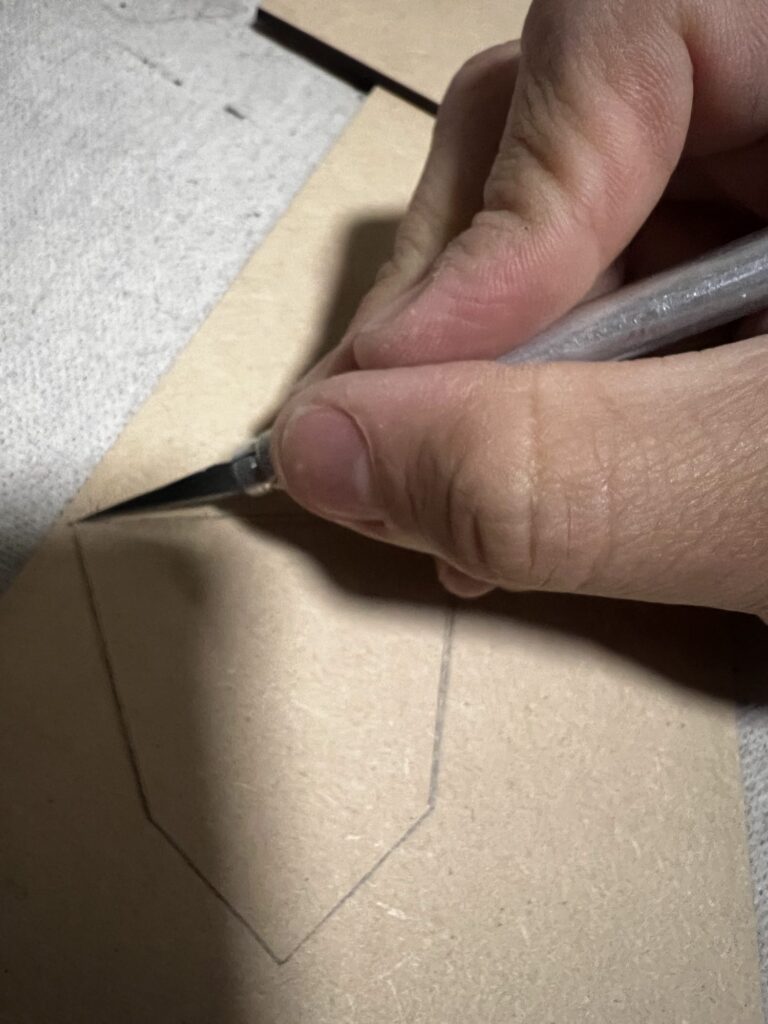 Diegodalo finishing laser-cut MDF details by hand for the LASSA mural