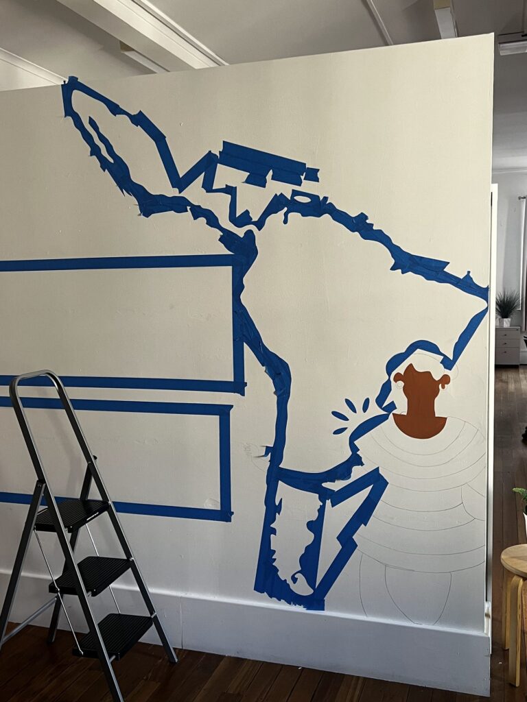 Latin America map taped out on the LASSA wall during the mural painting process in Adelaide