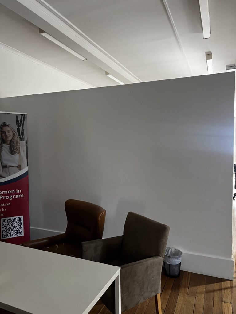 The LASSA office wall after restoration, repainted and ready to become a mural canvas