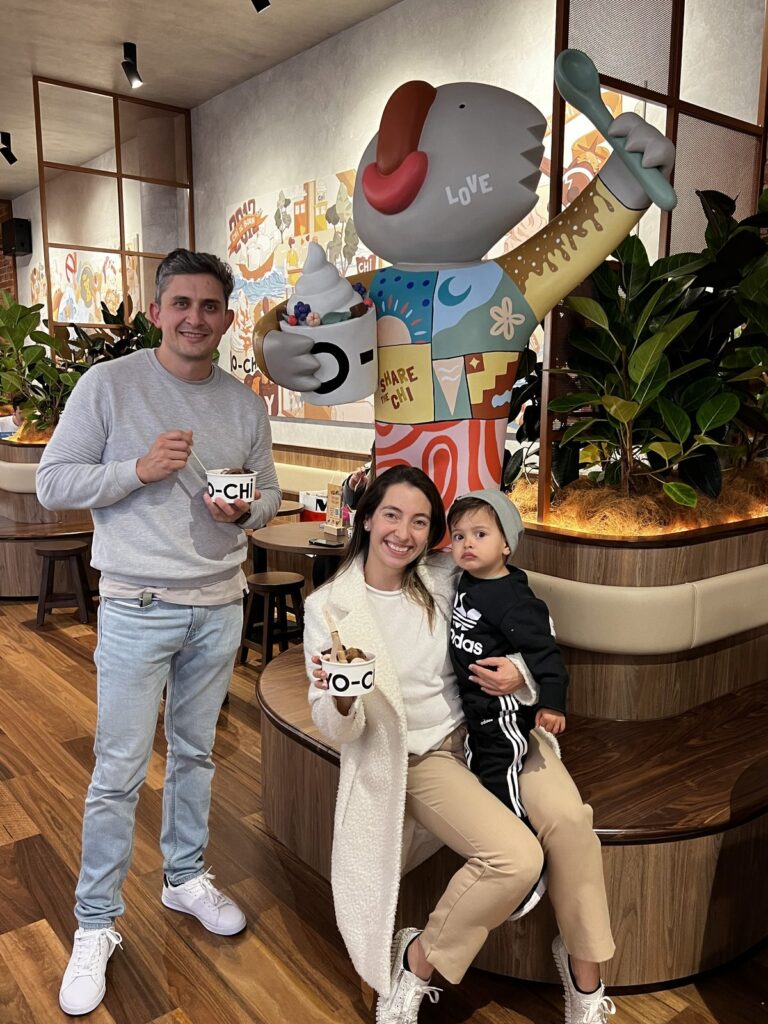 Diegodalo and family with the finished, colourful disco-inspired Yo-Chi Bear at Tri Plaza, Adelaide